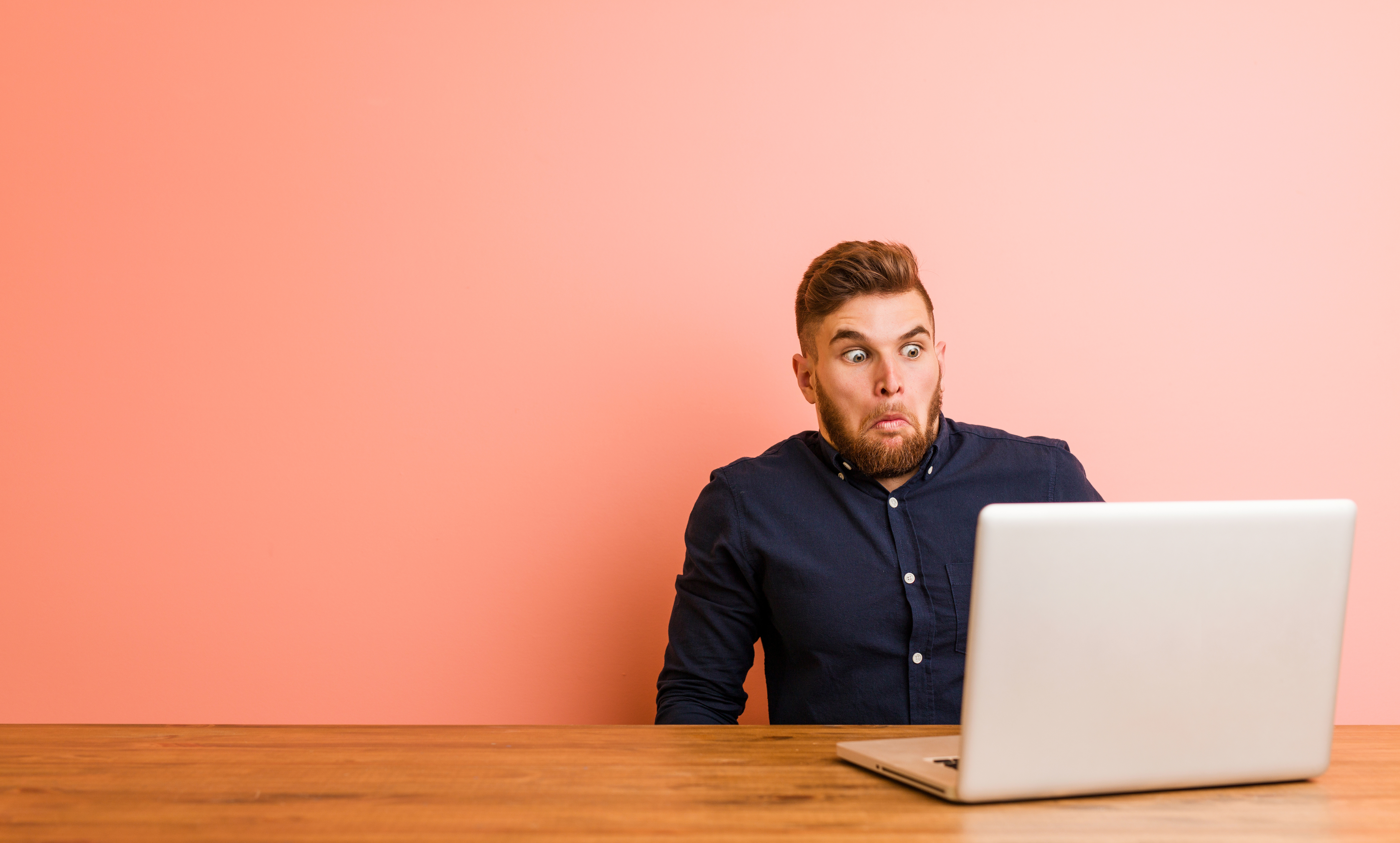 young man at laptop confused about google algorithm